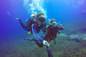 the perfect date weekend shows couple scuba diving